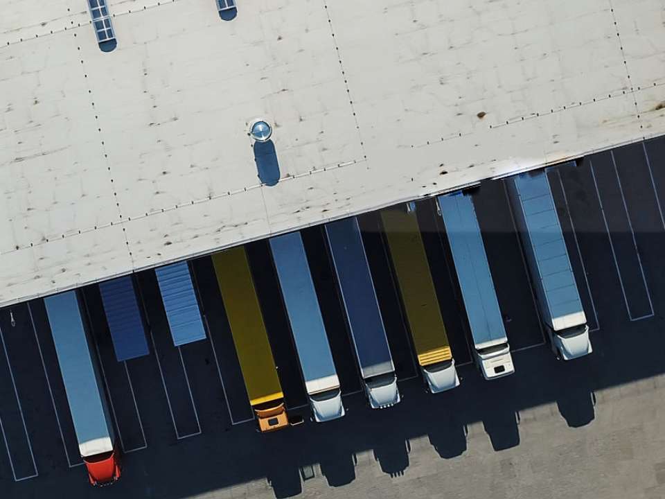 Many trucks lined up in depot